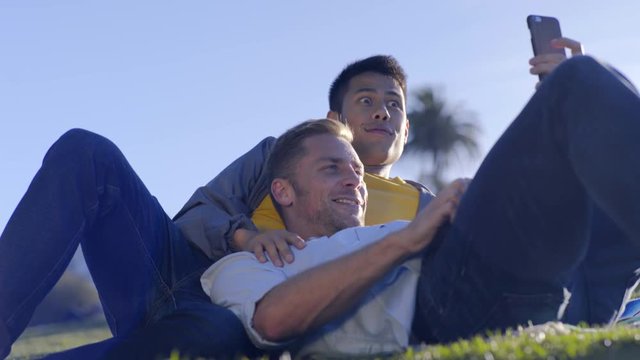Cute Gay Couple Take Silly Photos Together, Make Funny Faces, In Park