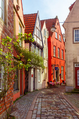 Fototapeta na wymiar Medieval Bremen street Schnoor with half-timbered houses in the centre of the Hanseatic City of Bremen, Germany