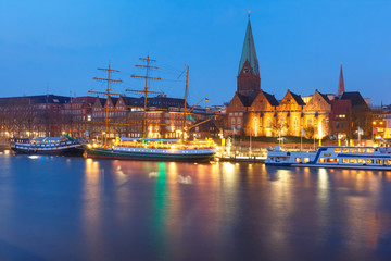 Night view of the Weser River and Protestant Lutheran Saint Martin Church in the old town of Bremen, Germany.