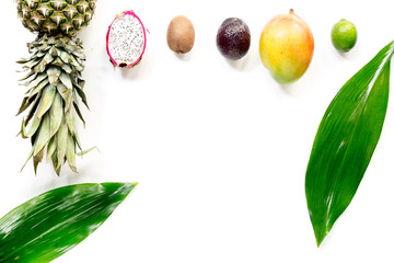 Exotic fruits food concept. Mangosteen, dragonfruit, mango, kiwi, pineapple on white background top view copyspace