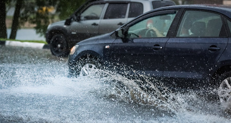 car rain puddle splashing water