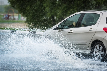 car rain puddle splashing water