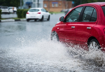 car rain puddle splashing water