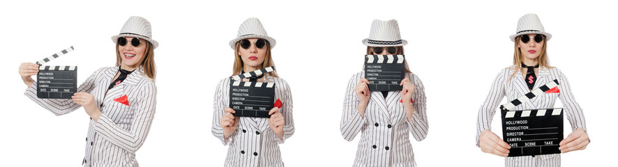 Beautiful girl in striped clothing holding clapperboard isolated