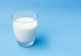 Glass of milk on blue background, food and drink for healthy concept