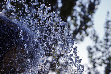 the blurred drops of water spray fountain