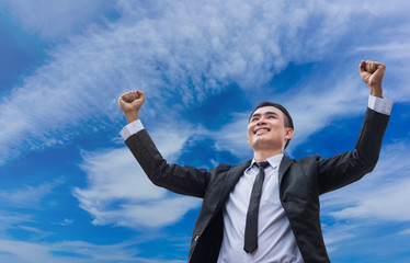 The businessmen are smile and commitment to success with sky background