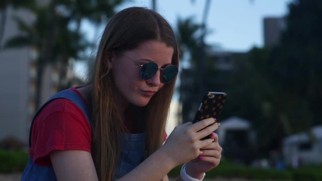 Teen Girl Poses For A Selfie, She Looks At It, Then Takes More, Maui, Hawaii