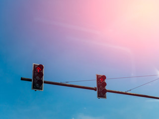 traffic lights against a vibrant blue sky with beautiful morning sunlight