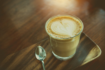 Coffee in a glass on wood table