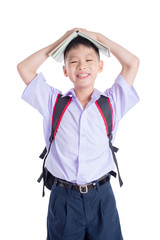 Young asian schoolboy smiling over white background