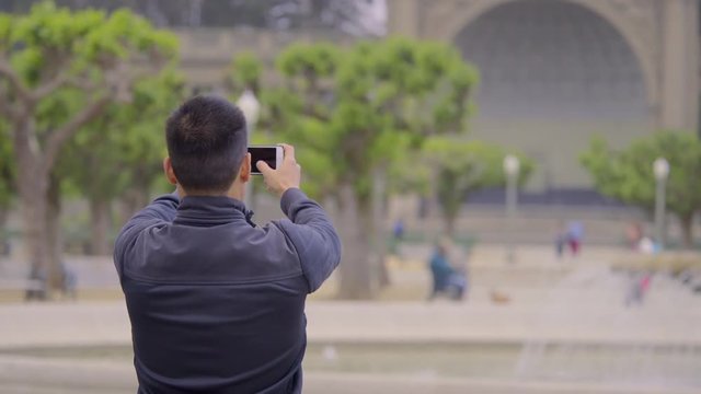 Man Takes A Photo Of A Beautiful Park Square In San Francisco 