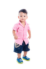 Little asian boy standing over white background