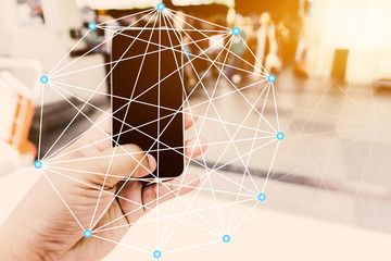 Hand holding smartphone. Social media with telecommunication technology, on abstract background, Connected lines. telecommunication concept. Best Internet Concept. Mixed media