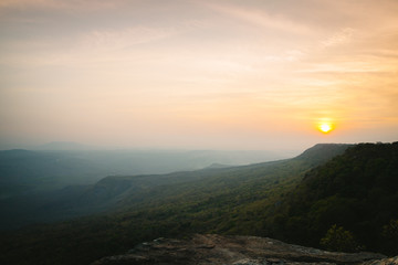 Sunset scene with pine forest and mountain in Pha Mak Duk, Phu Kradueng National Park, Thailand.