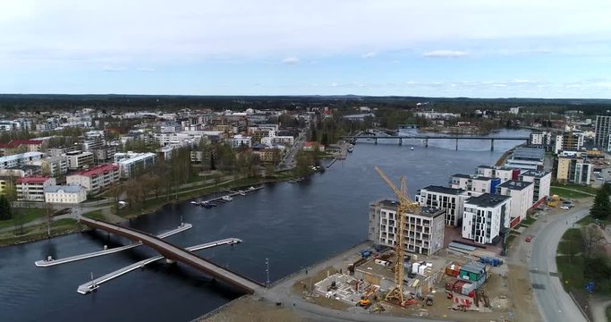Joensuu, Cinema 4k aerial landing view of joensuu cityscape and pielisjoki river, on a sunny summer day, in Turku, Finland