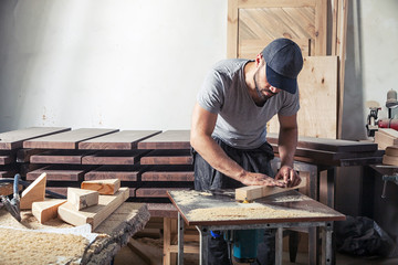man equals  wooden with a milling machine