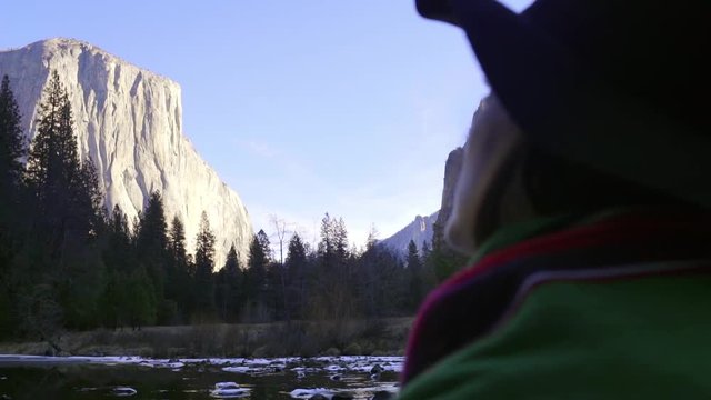 Woman Looks Up At The Majestic View Of El Capitan In Yosemite National Park 