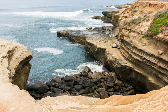 Sunset Cliffs in San Diego with waves crashing on rocks