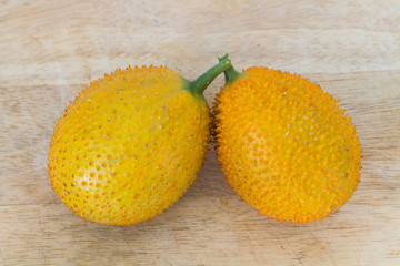 Gac Fruit Or Baby Jackfruit / Gac Fruit Or Baby Jackfruit On Wooden Background.