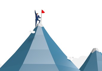 Businessman with flag on mountain top