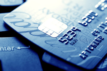 Close up of credit card with chip and numbers