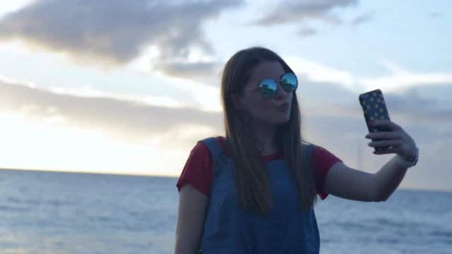 Teen Girl Poses For Cute Selfies At Sunset On Beach, Maui, Hawaii
