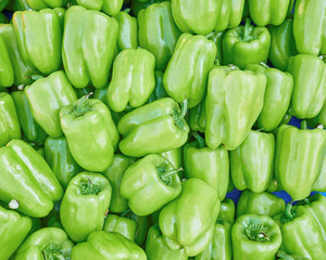 Plakat organic green bell peppers top view, natural background