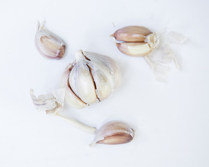 Closeup of garlic cloves on white background
