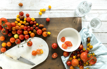 Naklejka na ściany i meble Fresh natural tomatoes on a cutting board