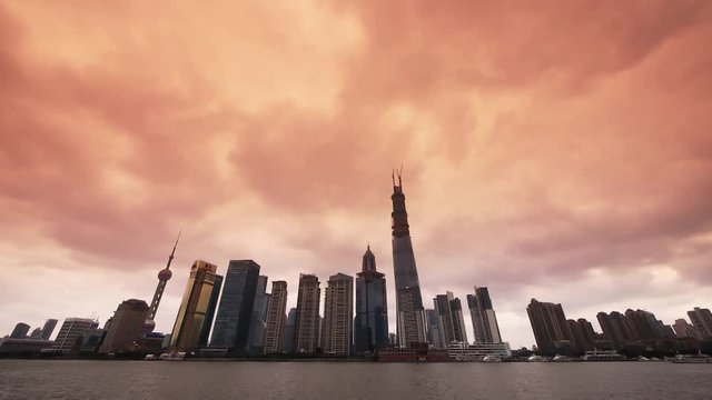 Shanghai bund sunset glow,Lujiazui Financial Center,busy Huangpu River shipping.