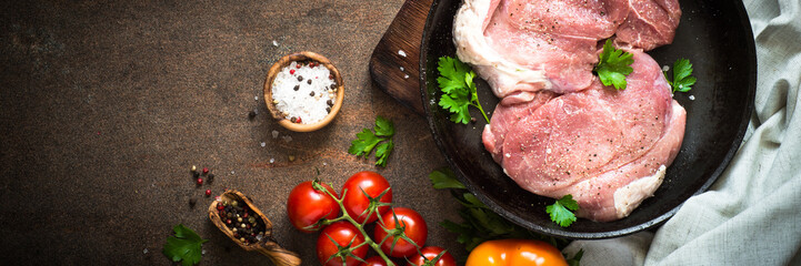 Raw pork meat in the pan. Long banner format