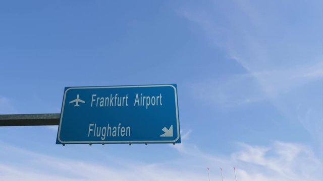 frankfurt airport sign airplane passing overhead
