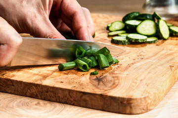 slicing vegetables with a knife for cooking