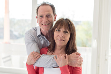 Fototapeta premium Happy senior couple embracing each other