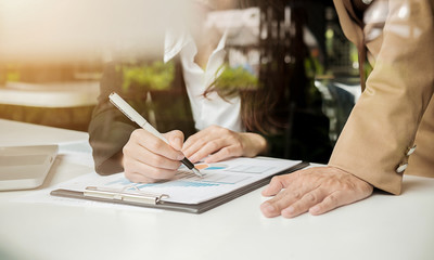 Business woman working at office with laptop and documents on his desk. Business concept.