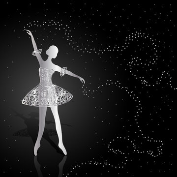 Silver ballerina on dark background.