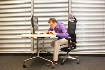  Near-sightedness, myopia. Caucasian office worker at work station