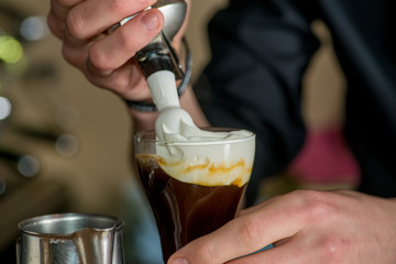 Bartender prepares a cocktail