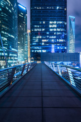 view of footbridge at night in city of China.