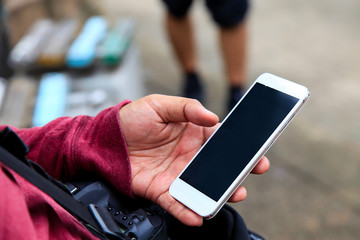 Photographer using mobile smart phone.