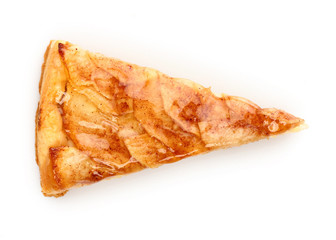Close up of a single slice of apple pie isolated on white. View from above