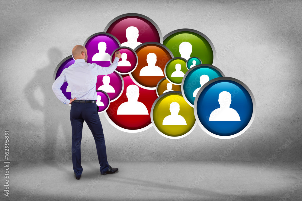 Poster businessman in front of a wall with a group of contact icon displayed on a technology interface back