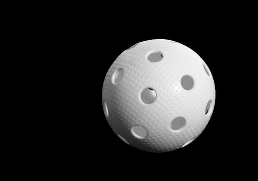 Floorball ball isolated on black