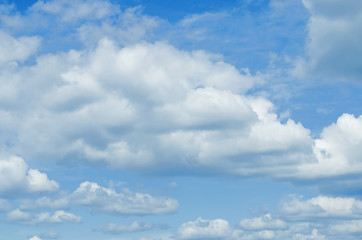 Naklejka na ściany i meble Sunny blue sky backgrond with clouds Photo