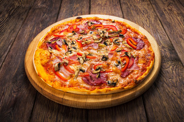 Delicious pizza with mushrooms and smoked chicken