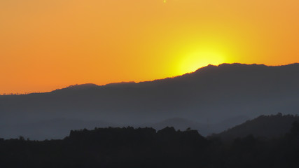 Sunrise behind the mountain, motivation concept