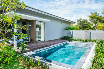 Tropical beach resort. Swimming pool near living room