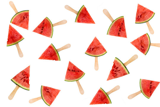 Many watermelon slice popsicles isolated on white background, fresh summer fruit concept