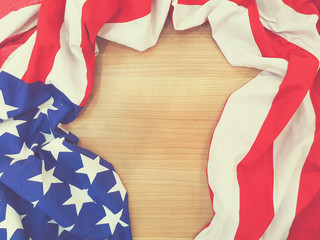 abstract vintage blurred crumpled retro american flag on wood plain surface background for fourth of july concept
